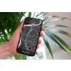 mockup of a woman holding a clear phone case in front of a houseplant 4636 el1 (4)