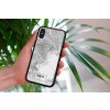 mockup of a woman holding a clear phone case in front of a houseplant 4636 el1