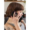 phone grip mockup featuring a woman with tattoos sitting on a couch 28155 (1)