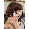 phone grip mockup featuring a woman with tattoos sitting on a couch 28155 (2)
