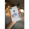 phone grip mockup with string lights in the background 22146