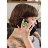 phone grip mockup featuring a woman with tattoos sitting on a couch 28155 (5)