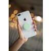 phone grip mockup with string lights in the background 22146