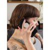 phone grip mockup featuring a woman with tattoos sitting on a couch 28155 (2)