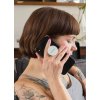 phone grip mockup featuring a woman with tattoos sitting on a couch 28155 (2)