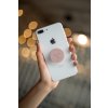 phone grip mockup with string lights in the background 22146