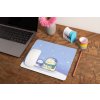 mockup of a mousepad lying on a rustic table next to a flower vase 27554 (1)