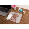 mockup of a mousepad lying on a rustic table next to a flower vase 27554 (3)