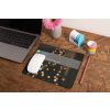 mockup of a mousepad lying on a rustic table next to a flower vase 27554 (1)