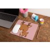 mockup of a mousepad lying on a rustic table next to a flower vase 27554 (1)