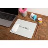 mockup of a mousepad lying on a rustic table next to a flower vase 27554 (3)