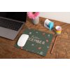 mockup of a mousepad lying on a rustic table next to a flower vase 27554 (1)