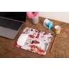 mockup of a mousepad lying on a rustic table next to a flower vase 27554
