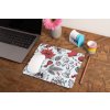 mockup of a mousepad lying on a rustic table next to a flower vase 27554 (2)