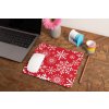mockup of a mousepad lying on a rustic table next to a flower vase 27554