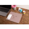 mockup of a mousepad lying on a rustic table next to a flower vase 27554 (3)