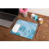 mockup of a mousepad lying on a rustic table next to a flower vase 27554 (1)