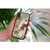 mockup of a woman holding a clear phone case in front of a houseplant 4636 el1 (2)