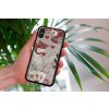 mockup of a woman holding a clear phone case in front of a houseplant 4636 el1 (2)