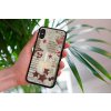 mockup of a woman holding a clear phone case in front of a houseplant 4636 el1