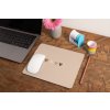 mockup of a mousepad lying on a rustic table next to a flower vase 27554