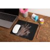 mockup of a mousepad lying on a rustic table next to a flower vase 27554