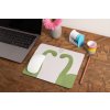mockup of a mousepad lying on a rustic table next to a flower vase 27554 (1)