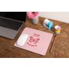 mockup of a mousepad lying on a rustic table next to a flower vase 27554