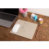 mockup of a mousepad lying on a rustic table next to a flower vase 27554