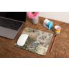 mockup of a mousepad lying on a rustic table next to a flower vase 27554