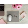 mousepad mockup over a wooden surface by some flowers and a laptop 27560