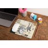mockup of a mousepad lying on a rustic table next to a flower vase 27554