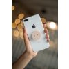 phone grip mockup with string lights in the background 22146