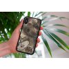 mockup of a woman holding a clear phone case in front of a houseplant 4636 el1 (60)