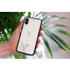 mockup of a woman holding a clear phone case in front of a houseplant 4636 el1 (75)