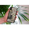 mockup of a woman holding a clear phone case in front of a houseplant 4636 el1 2023 03 16T114517.890