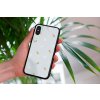 mockup of a woman holding a clear phone case in front of a houseplant 4636 el1 2023 03 29T094950.504