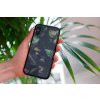 mockup of a woman holding a clear phone case in front of a houseplant 4636 el1 2023 03 30T110446.150