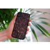 mockup of a woman holding a clear phone case in front of a houseplant 4636 el1 2023 03 30T111414.425