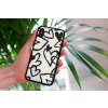mockup of a woman holding a clear phone case in front of a houseplant 4636 el1 (53)