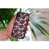 mockup of a woman holding a clear phone case in front of a houseplant 4636 el1 (73)