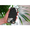 mockup of a woman holding a clear phone case in front of a houseplant 4636 el1 (80)