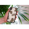 mockup of a woman holding a clear phone case in front of a houseplant 4636 el1 (77)