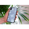 mockup of a woman holding a clear phone case in front of a houseplant 4636 el1 2022 04 27T120921.391
