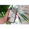 mockup of a woman holding a clear phone case in front of a houseplant 4636 el1 2022 05 04T134559.466