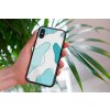 mockup of a woman holding a clear phone case in front of a houseplant 4636 el1 2022 05 23T144443.668