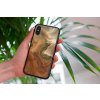 mockup of a woman holding a clear phone case in front of a houseplant 4636 el1 2022 04 26T121224.001