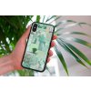 mockup of a woman holding a clear phone case in front of a houseplant 4636 el1 (23)