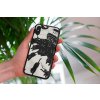 mockup of a woman holding a clear phone case in front of a houseplant 4636 el1 (4)