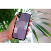 mockup of a woman holding a clear phone case in front of a houseplant 4636 el1 (65)